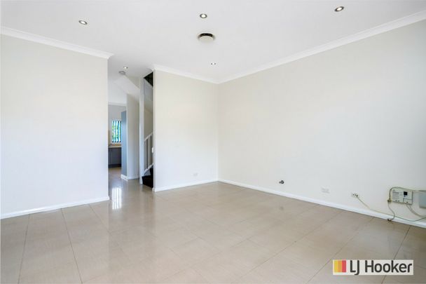 This 5 bedroom townhouse is an absolute must to inspect! - Photo 1