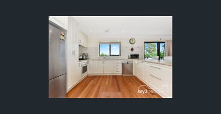 Spacious Family Haven with Breathtaking Views and Multiple Living Areas - Photo 3