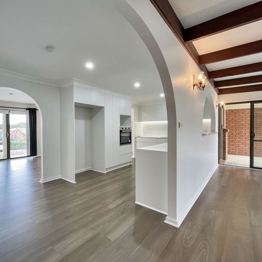 Renovated 3-Bedroom Home with Double Garage & Multiple Living Areas - Photo 1