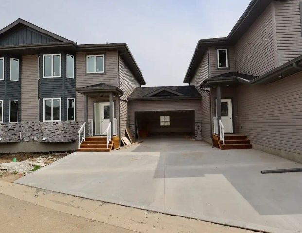 Deer Valley Leduc 2 Bed Plus Den 2.5 Bath Townhouse with Garage NOW FOR RENT! — 2 Bedrooms+ Den Townhouse - Photo 1