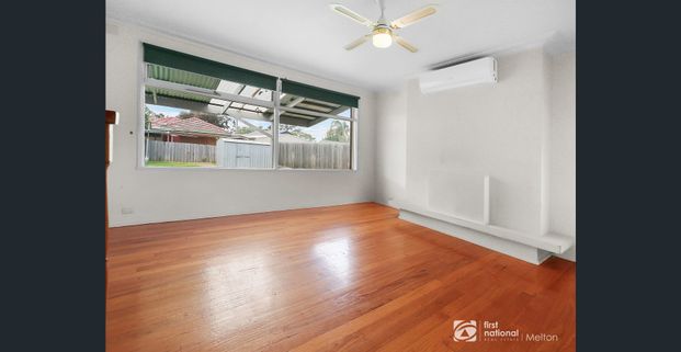 Charming Three-Bedroom Home - Photo 1