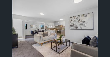 Spacious Renovated Home with Multiple Living Areas + Kitchenette - Photo 2