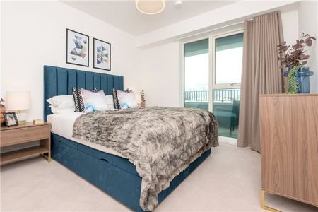 This contemporary two-bedroom apartment is located within Wallbrook Gardens, a beautiful development benefitting from exceptional on-site amenities, communal gardens and only a 6-minute walk to Canning Town Station. - Photo 4