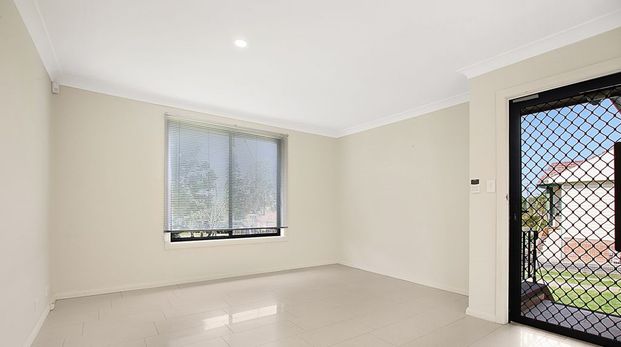 Your Perfect Family Retreat Awaits – Charming Home with a Large Yard! - Photo 1