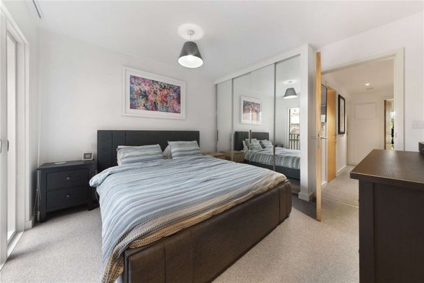 SINGLE HOUSEHOLD ONLY. The property comprises of an open plan kitchen and reception room, master bedroom with en-suite and access to a private balcony. - Photo 1