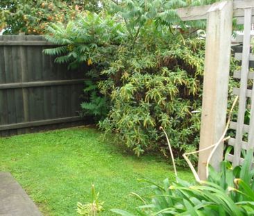 Fenced courtyard, garden and single garage with this two bedroom to... - Photo 5