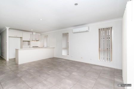 Spacious 4-Bedroom Home with Low-Maintenance Yard - Photo 2