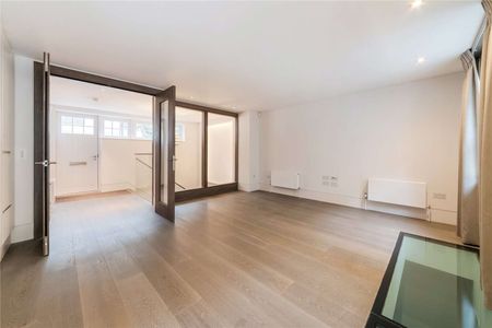 This beautifully refurbished three bedroom mews house is located close to the amenities of Sloane Square and Knightsbridge - Photo 2