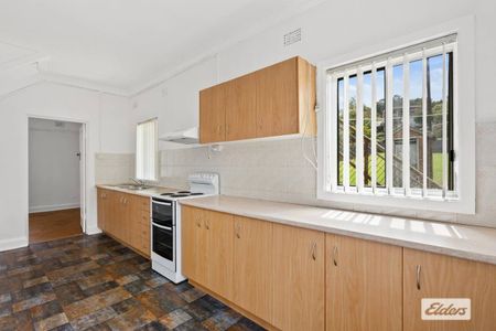 Neat & Tidy Family Home | Split-Level Living in Prime Location - Photo 3