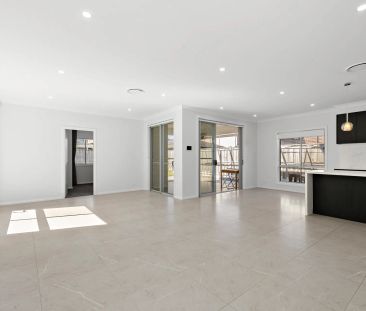 Modern Luxury with Multiple Living Zones & Low-Maintenance Backyard - Photo 1