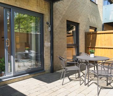 A fully furnished, one-bedroom apartment with a private balcony and... - Photo 6