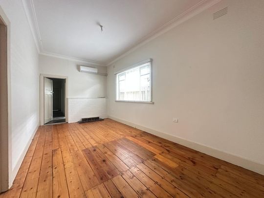 Spacious 3-Bedroom Home with Sunroom & Great Backyard - Photo 1