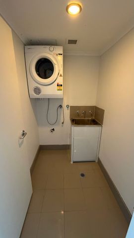 Spacious Four-Bedroom Home with Split-Level Design in a Peaceful Harbourside Setting - Photo 3