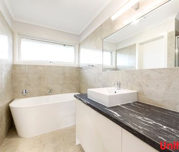 Location, location, location with modern unit - Photo 5