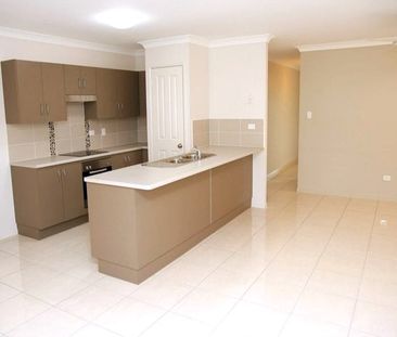 Spacious Four-Bedroom Home with Fully Fenced Yard in Bohle Plains! - Photo 4