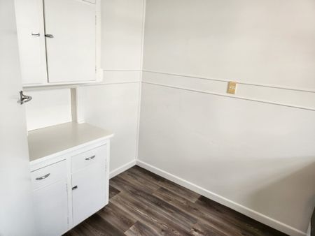 Step inside this beautifully recently renovated one-bedroom unit featuring new carpet, fresh paint, and new vinyl flooring throughout. - Photo 5
