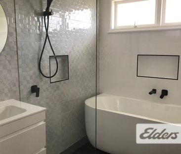 Convenient Home with Modern Kitchen & Bathroom - Photo 6