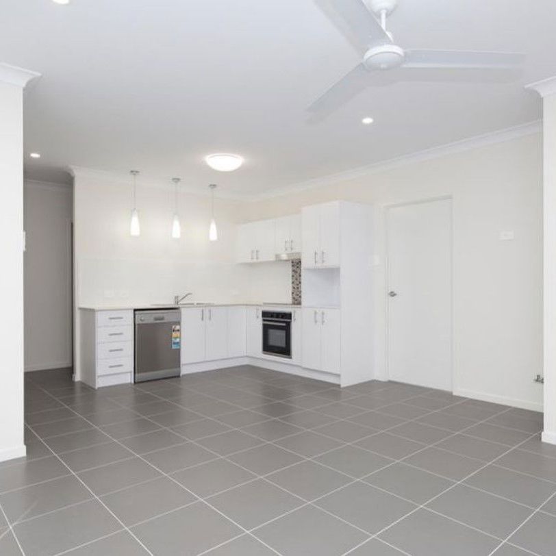 YOUR NEW FAMILY HOME AWAITS YOU! - Photo 1