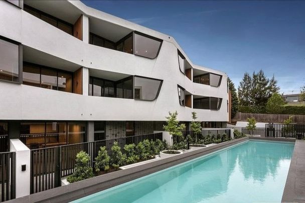 Modern Urban Living with Poolside Views! - Photo 1