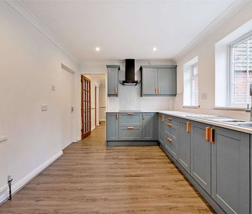 An updated four bedroom detached home located only 1.3 miles to the... - Photo 6