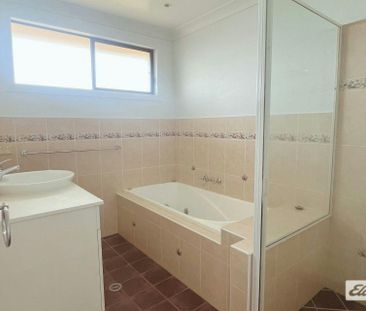 Generous Living Across Five Bedrooms - Photo 2