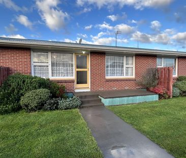 Two Bedroom Unit with Private Garden and Garage! - Photo 2