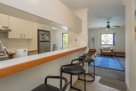 Embrace the coastal lifestyle in this charming 2-bedroom, 1-bathroom apartment with shared Pool and Tennis court - Photo 3