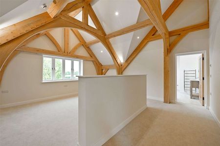 A grand oak-framed country home with vaulted ceilings and striking architectural detail - Photo 4