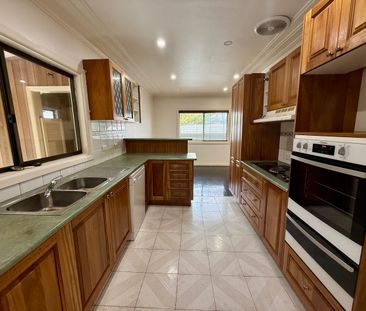 Spacious Three-Bedroom Residence on a large corner block - Photo 4