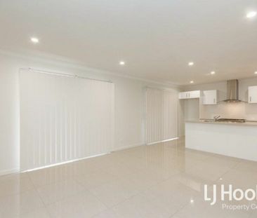 Modern Family Home with Stylish Finishes & Low-Maintenance Living - Photo 1