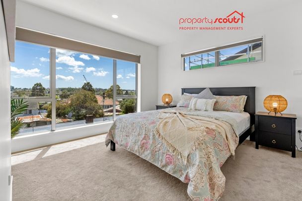 Spacious Designer Home with Flexible Living Across Three Levels - Photo 1