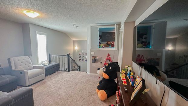 Stylish Auburn Bay Duplex With Garage & Newly Finished Basement - Photo 1