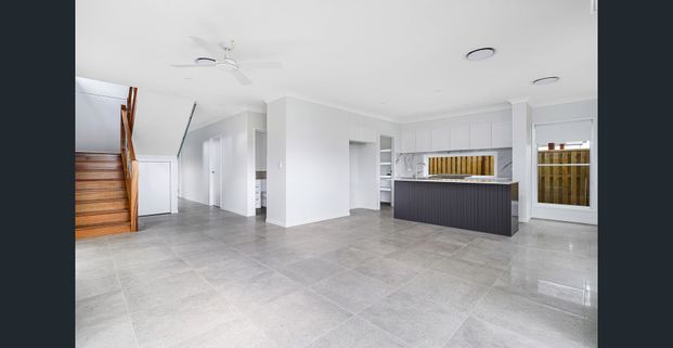 Modern Family Home with Multiple Living Spaces - Prime Gainsborough Greens Location - Photo 1