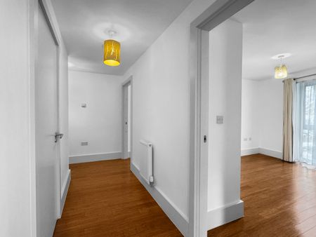 Situated along the High Street overlooking a private communal garden, this modern 2 bedroom flat offers a large balcony, open plan living/dining/kitchen area and allocated parking. - Photo 5