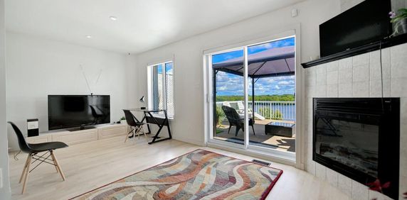 Maison en rangé à louer aux abords de la rivière des Prairies à Laval - Photo 2