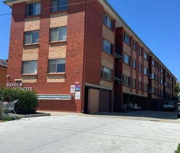Neat Two Bedroom Top Floor Unit - Photo 3