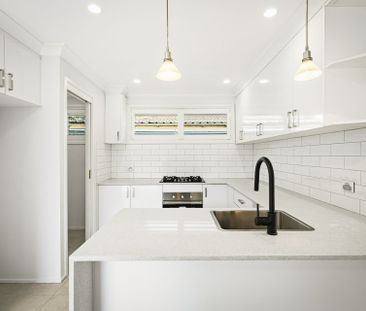 Freshly Renovated Home with Modern Style & Spacious Yard - Photo 4