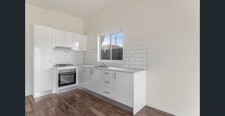 Modern Two-Bedroom Gem with Private Yard! - Photo 3