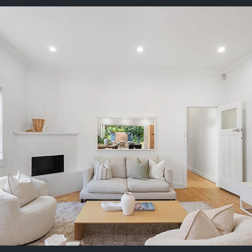 Sun-Drenched Coastal Semi with Charming Period Features - Photo 1