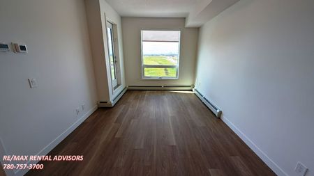 BRAND NEW 1 BED, 1 BATH 5th-FLOOR APARTMENT W/AN UNDERGROUND PARKING STALL IN THE COMMUNITY OF EAST HILLS CROSSING - Photo 3