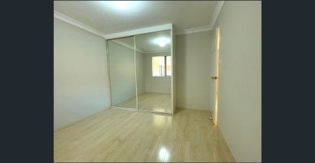 Spacious Top-Floor 2 Bedroom Unit with Lock-Up Garage & Balcony - Photo 4