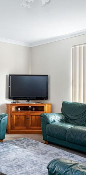Step into this neat and tidy 3x1 home, offering comfortable living and plenty of charm. - Photo 1