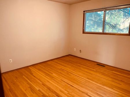 Bright 2 Bed Home Near U Of C | Garage + Laundry - Photo 5