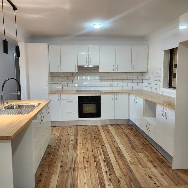 STYLISH FAMILY HOME READY TO MOVE IN - Photo 1