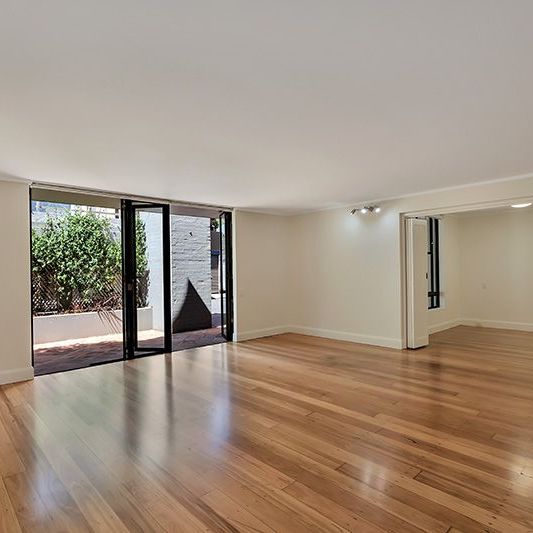 Two Bedroom Apartment with Large Courtyard and Parking - Photo 1