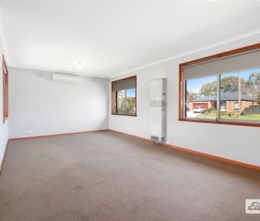 Charming 3-Bedroom Home with Modern Comforts & Outdoor Storage - Photo 6