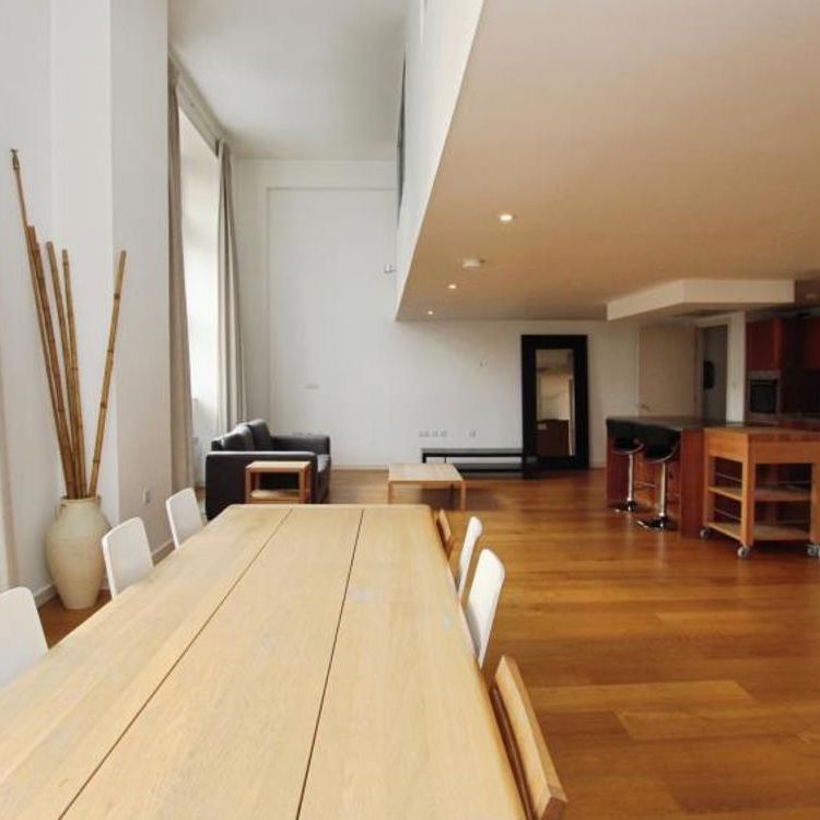 An impressive two double bedroom, split-level apartment with double-height ceilings, set within the highly sought-after 10 Unity Street development. Occupying part of a beautifully converted historic building, the apartment offers spacious open-plan living, floor-to-ceiling windows, two en-suite bedrooms and secure underground parking in a prime city-centre location. - Photo 1