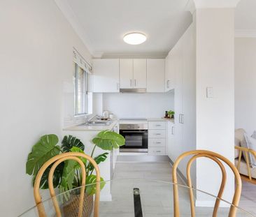 Top Floor Coastal Living with Light, Privacy and Lifestyle Convenience - Photo 1