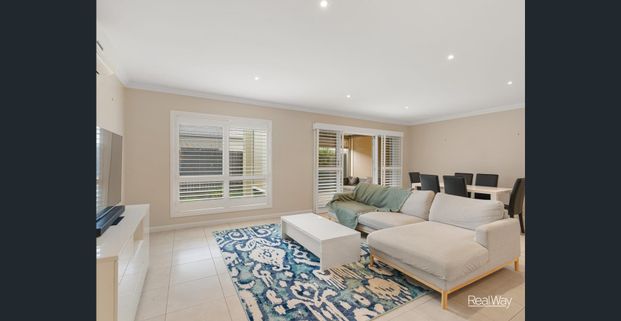 Comfortable Living with Private Outdoor Space in Sought-After Centenary Heights - Photo 1