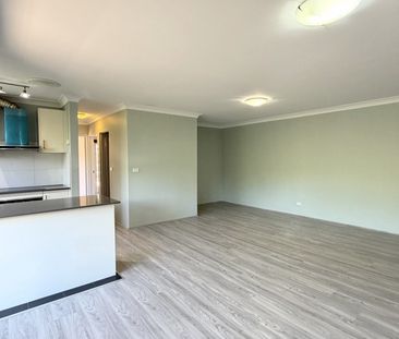 OVERSIZED 2 BEDROOM APARTMENT WITH LOCK UP GARAGE - Photo 1